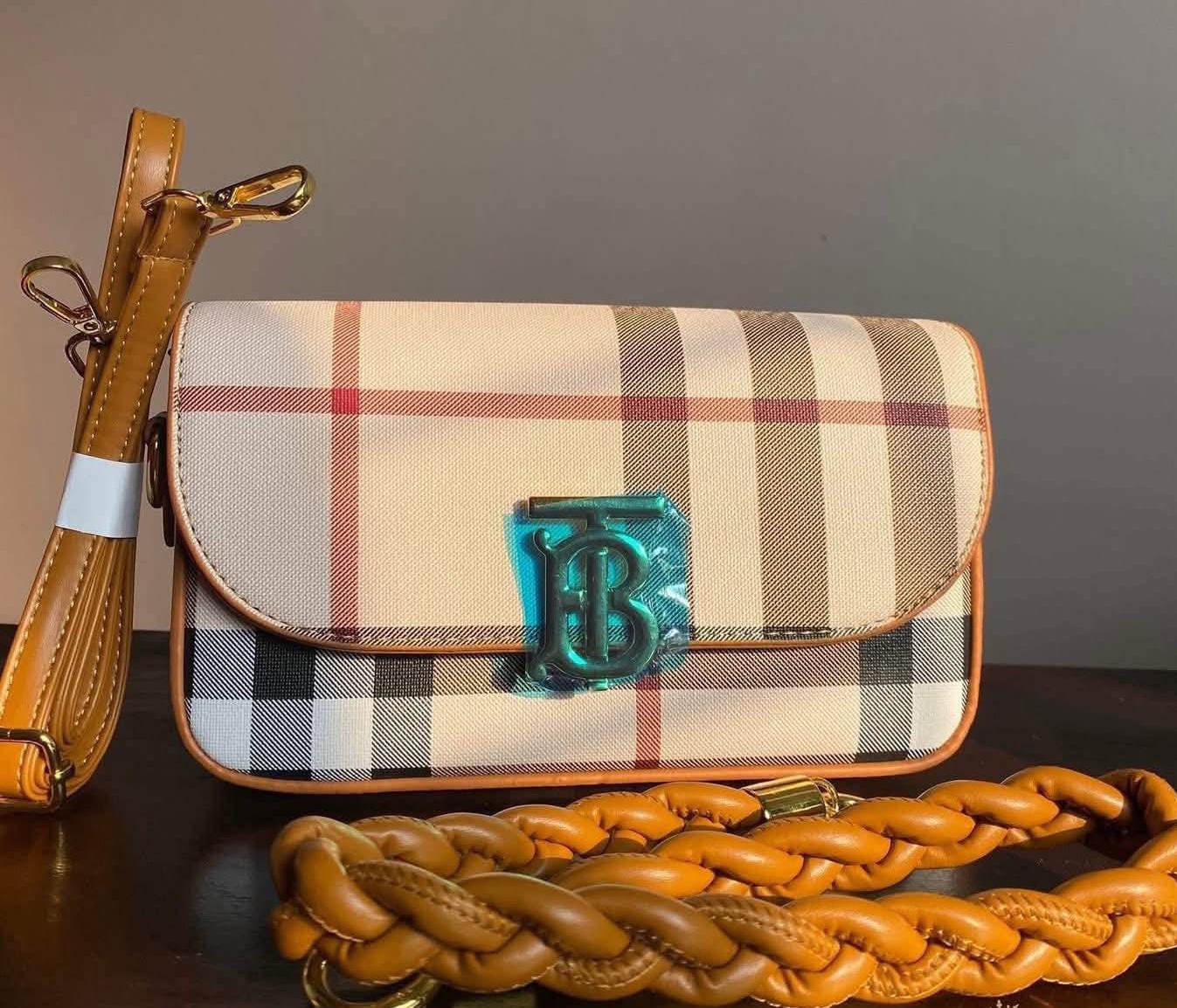 The top handle and the cross-body strap.